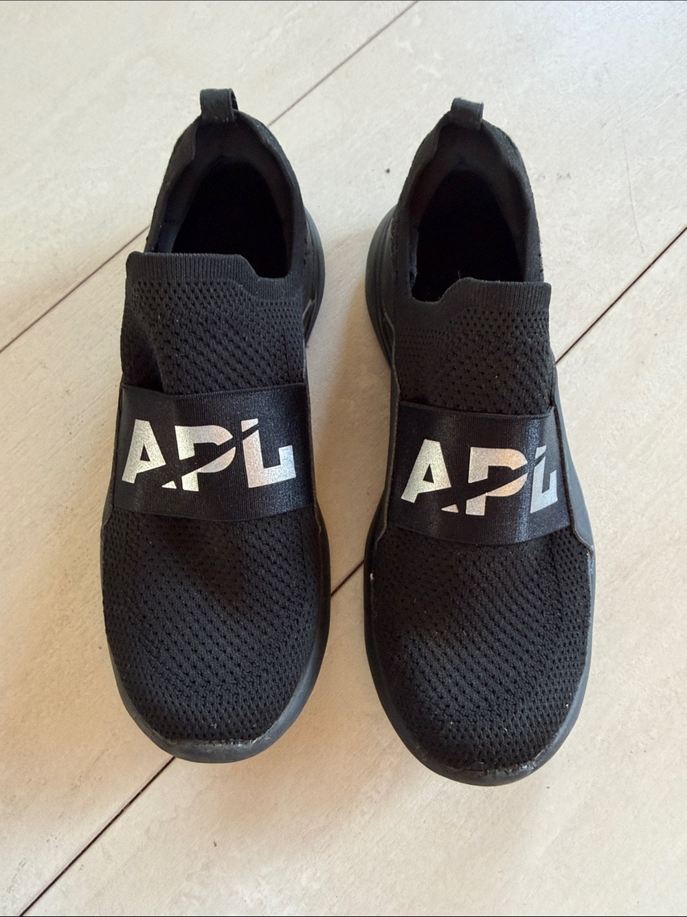 APL Black Slip-On Knit Sneakers with Silver Logo Band